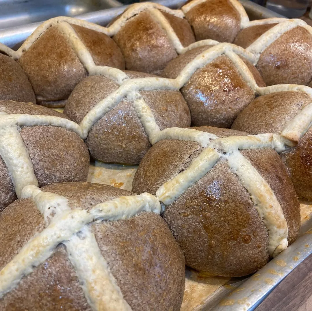 Hand-shaped bread cooling on a rack