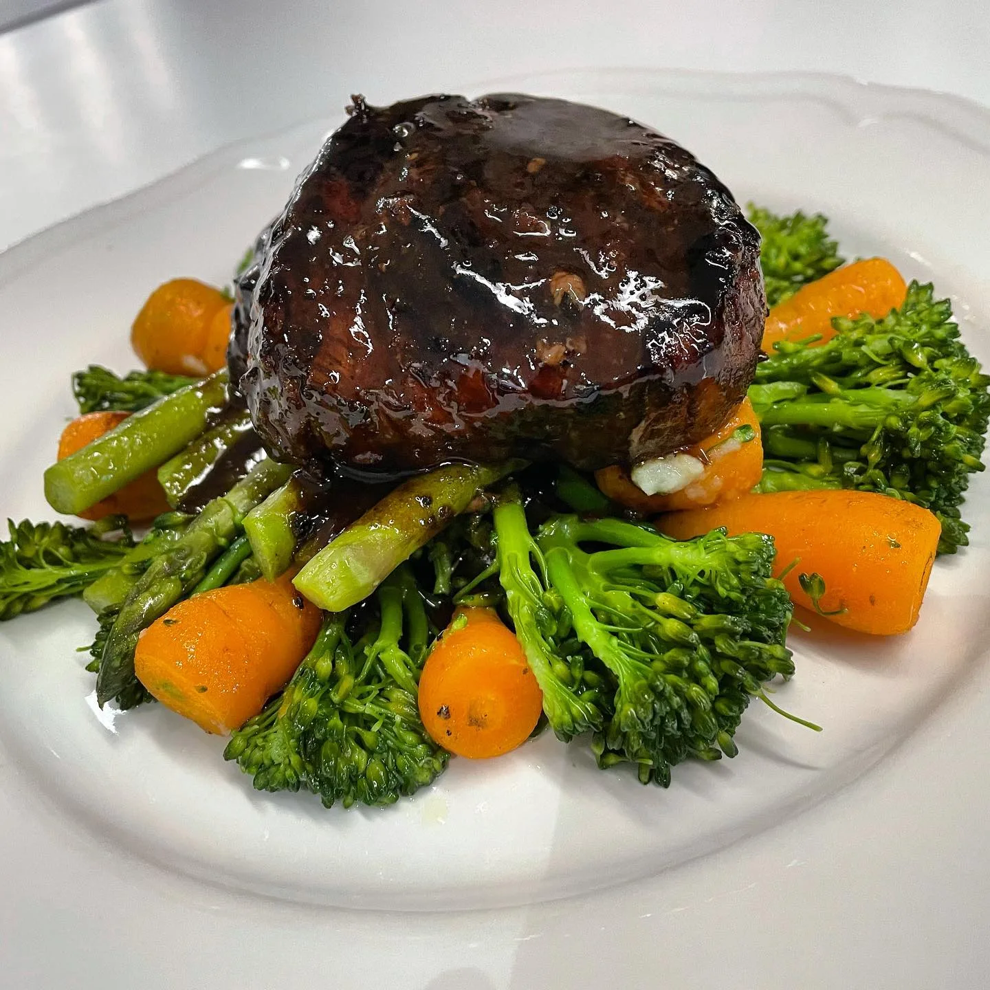 Glazed beef served with seasonal vegetables