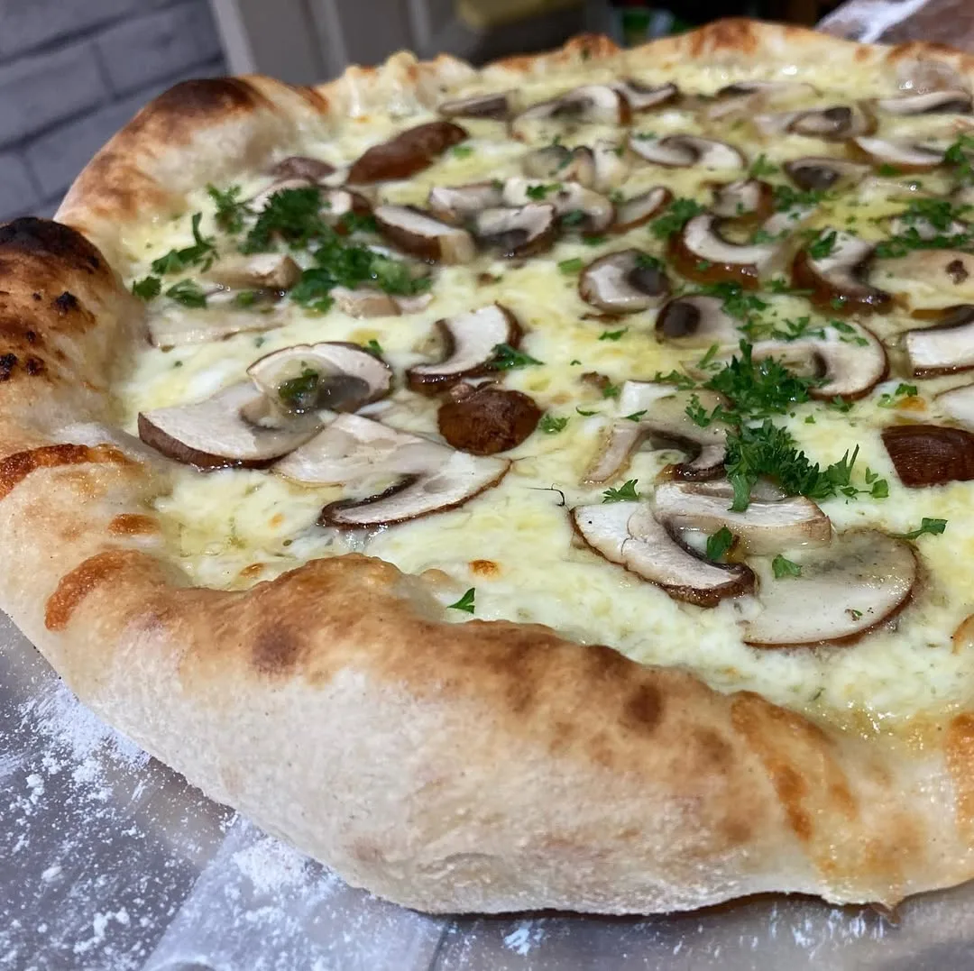Wild mushroom pizza with herbs
