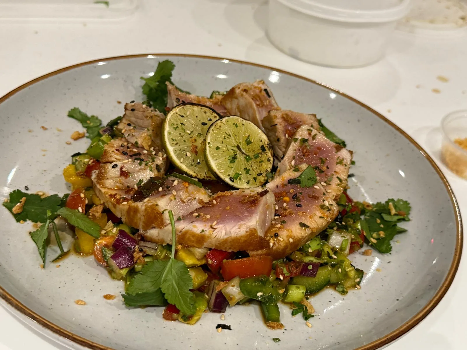 Seared tuna with fresh vegetables, prepared for a balanced performance-focused menu